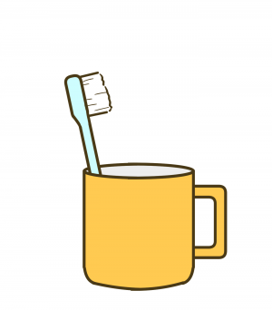 コップに立てかけられた歯ブラシ